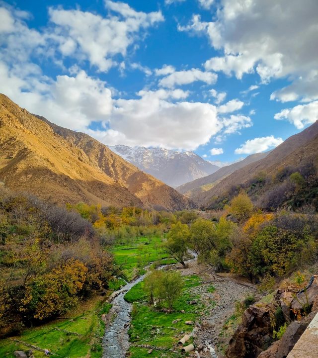 Beautiful mountain landscape in Imlil, Morocco with clear skies and vibrant greenery.